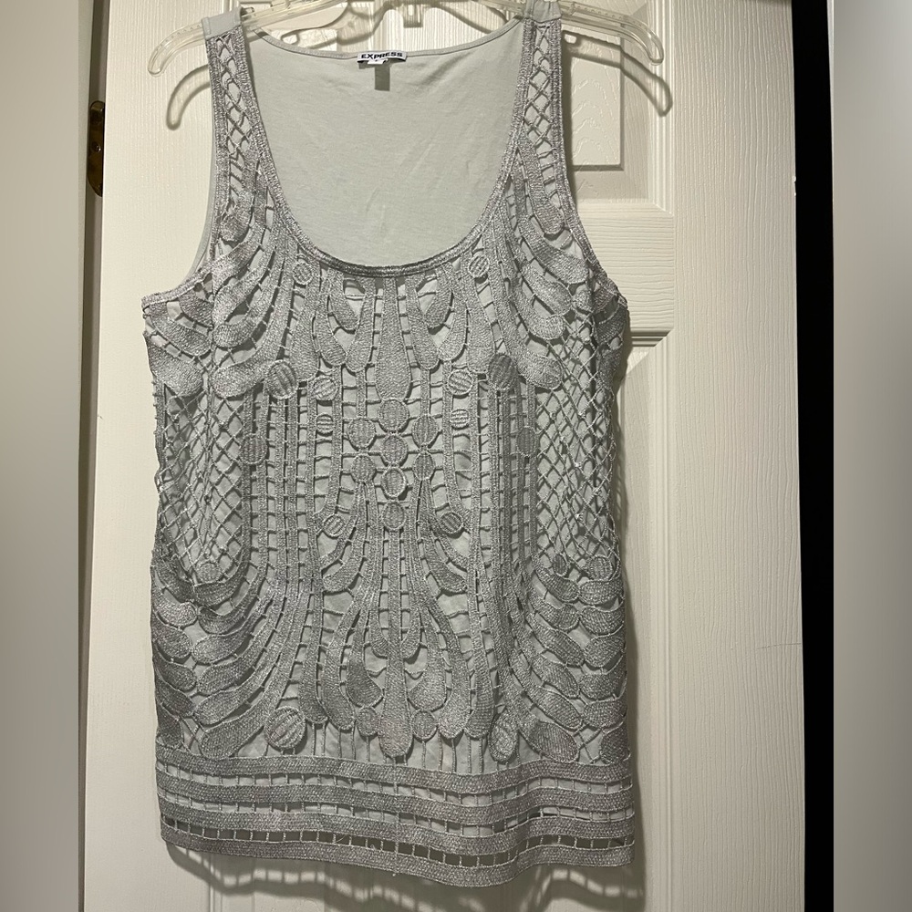 A silver color sleeveless top